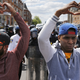 Hearts in the air in front of police. (Reuters/Jim Bourg)